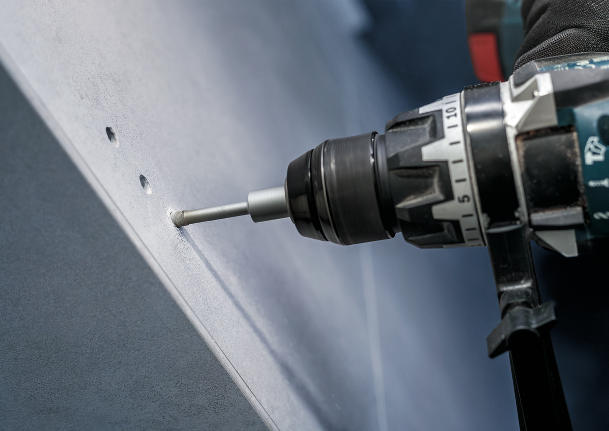 Bosch PRO Ceramic dry Drill Bit in use with power drill on ceramic wall, showing clean hole drilling performance without water cooling.