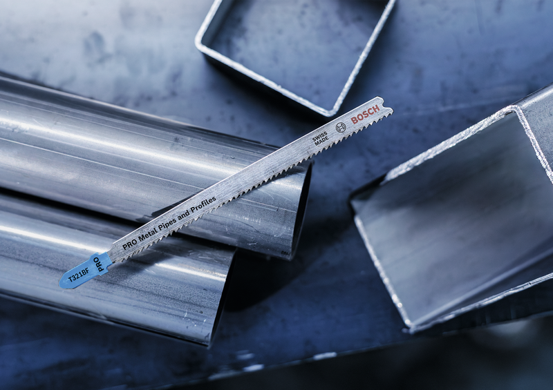 Bosch T321BF Jigsaw Blade placed on metal pipes and profiles, highlighting its application for professional metal cutting tasks.
