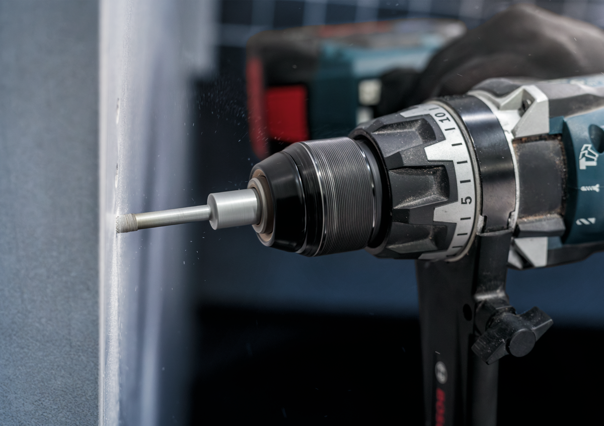 Side view of Bosch PRO Ceramic dry Drill Bit drilling into tile, demonstrating efficient dry drilling with minimal dust and clean finish.