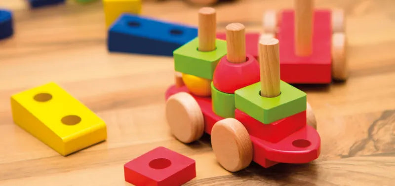 Children's wooden toys coloured with Osmo Wood Wax Finish, a toy-safe wax for wood